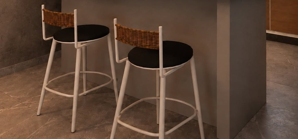 Rattan bar stools at a dark stone counter under pendant lights