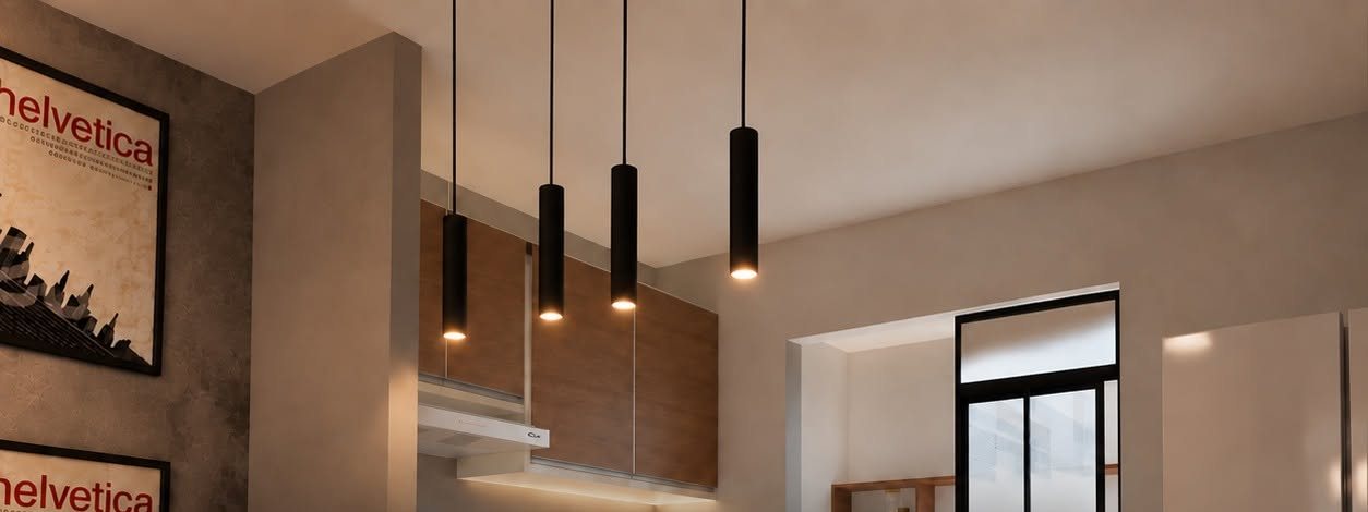 Kitchen with four black cylinder pendants, warm wood cabinets and a black-framed window