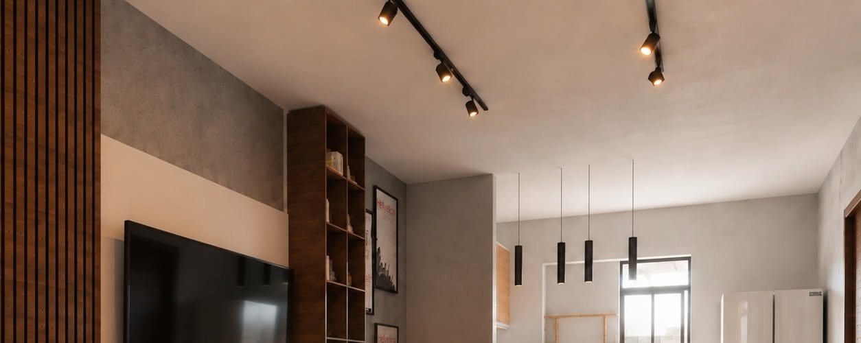 Open-plan living room with a slatted walnut wall, track lighting and black pendants over the kitchen
