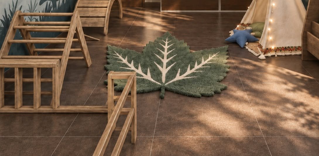 Wooden Pikler climbing set beside a leaf-shaped rug and a teepee with fairy lights